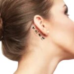 Japanese Letter Tattoo Idea 'Beautiful and Talented' behind the ear