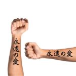 Japanese letter tattoo idea on arm, eternal love