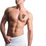 Meaningful Letter Symbol Chest Tattoo
