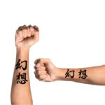 Japanese Letters Tattoo On Arm
